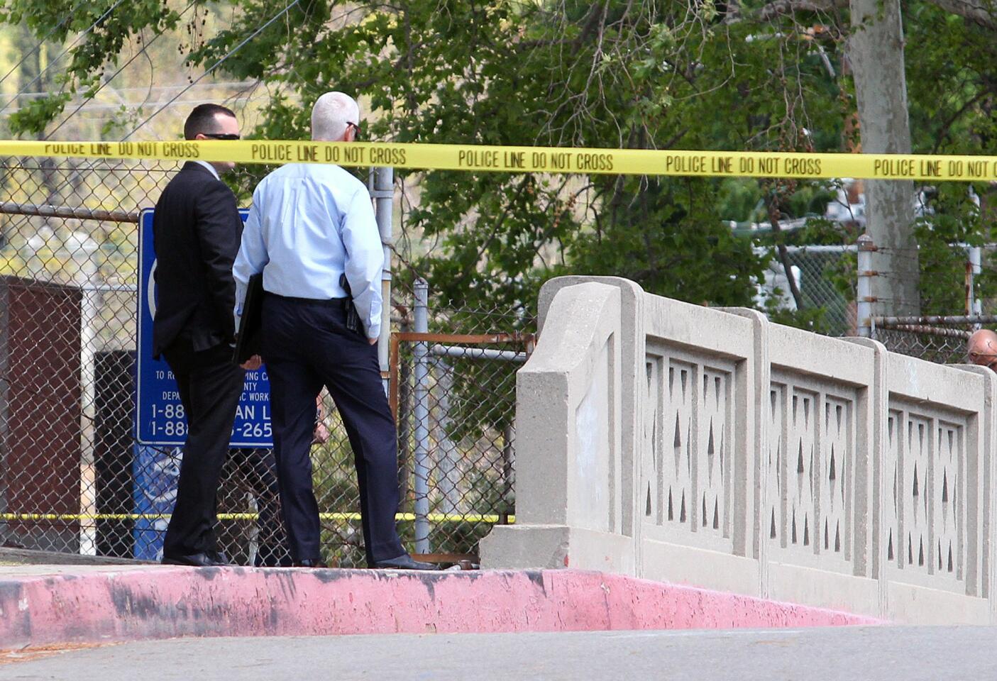 Photo Gallery: Body found in suitcase under Glorietta Avenue bridge