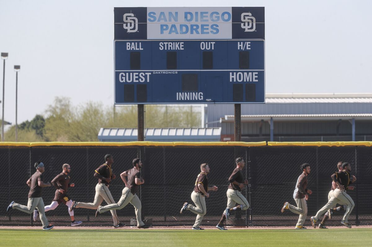 Padres players run during Padres spring training at the Peoria Sports Complex on Thursday, February 13, 2020 in Peoria, Arizona.