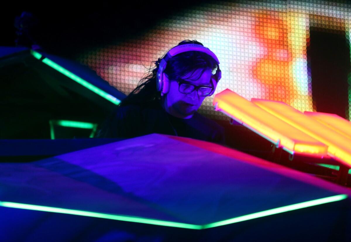 Skrillex performs onstage during day 2 of the 2014 Coachella Valley Music & Arts Festival.