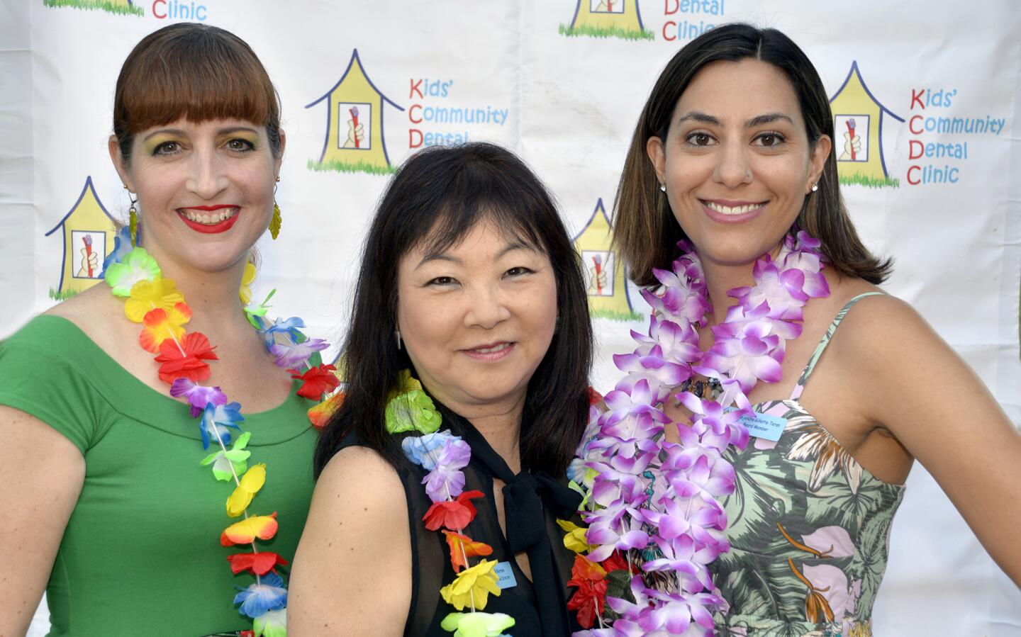 Clinic Executive Director Dale Morimizu Gorman, center, flanked by the co-chairs of last week’s fundraiser, Silvia Mancini, left, and Alejandra Gillette-Teran.