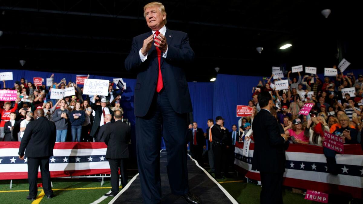 Republican presidential candidate Donald Trump arrives to speak at a campaign rally in Geneva, Ohio on Oct. 27.