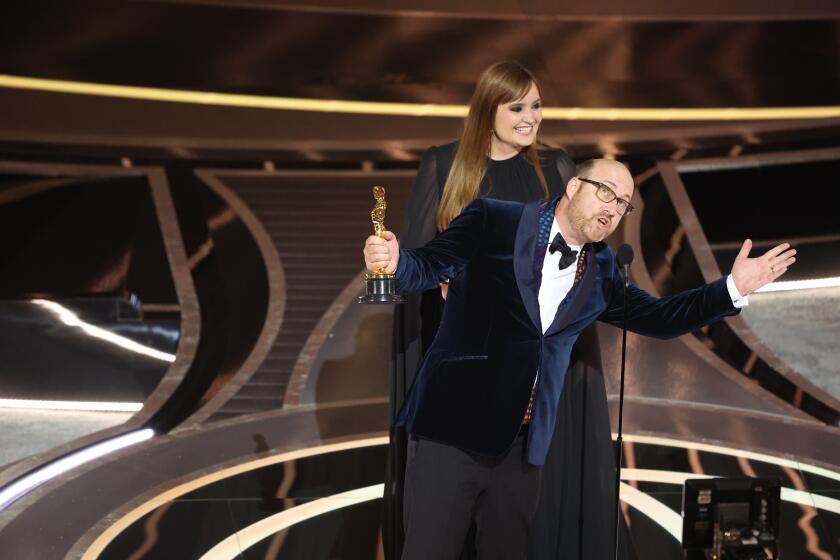 HOLLYWOOD, CA - March 27, 2022. "Dune" production designer Patrice Vermette and set designer Zsuzsanna Sipos(behind) accepts the award for Best Production Design for "Dune" during the show at the 94th Academy Awards at the Dolby Theatre at Ovation Hollywood on Sunday, March 27, 2022. (Myung Chun / Los Angeles Times)