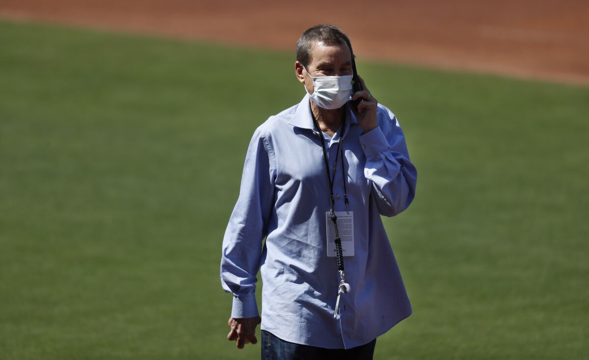 Padres Chairman Peter Seidler walks on the field before a summer camp practice at Petco Park.