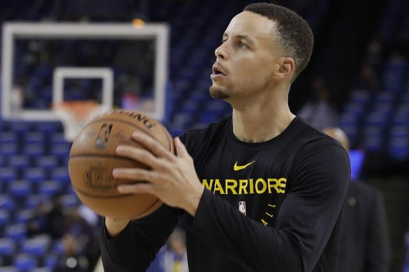 Golden State Warriors guard Stephen Curry warms up before an NBA basketball game between the Warriors and the Oklahoma City Thunder in Oakland, Calif., Wednesday, Nov. 21, 2018. (AP Photo/Jeff Chiu)