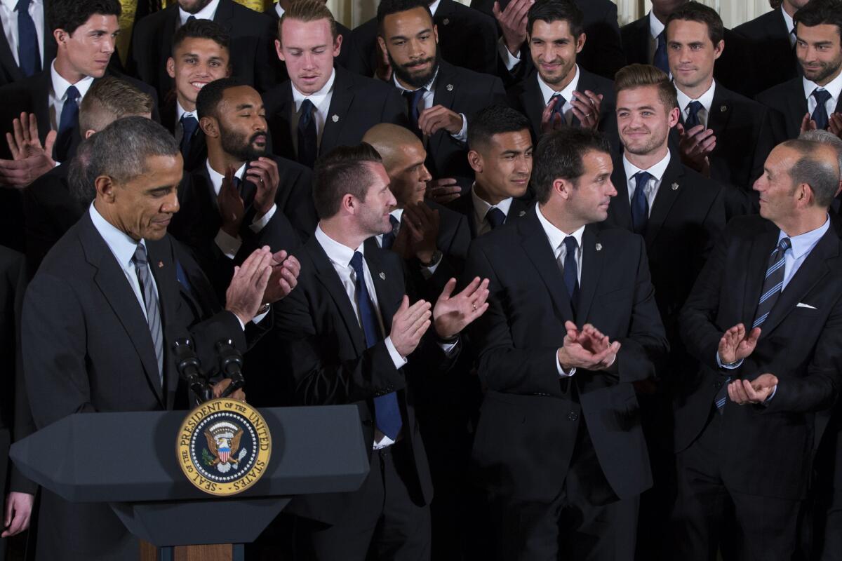 Galaxy midfielder Robbie Rogers, smiles as President Barack Obama recognizes him during a ceremony to honor the 2014 MLS Cup champions.