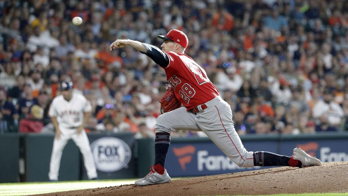 Angels starter Andrew Heaney lets go of a first-inning pitch against the Houston Astros on Saturday. Heaney gave up two runs in five innings.