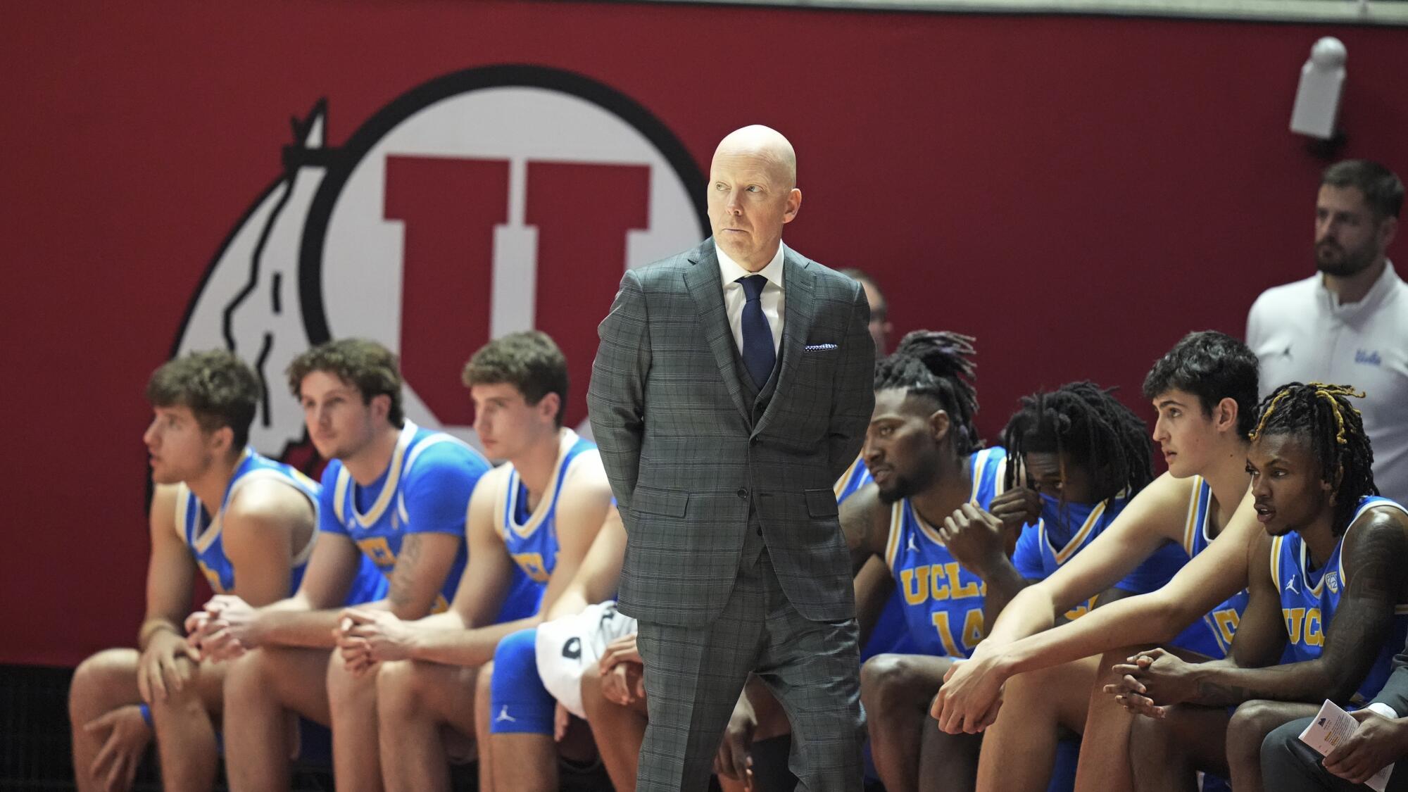 UCLA coach Mick Cronin, center, looks on during a blowout loss to Utah on Jan. 11.