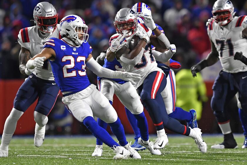 New England Patriots running back Damien Harris (37) carries the ball during the first half of an NFL football game against the Buffalo Bills in Orchard Park, N.Y., Monday, Dec. 6, 2021. (AP Photo/Adrian Kraus)