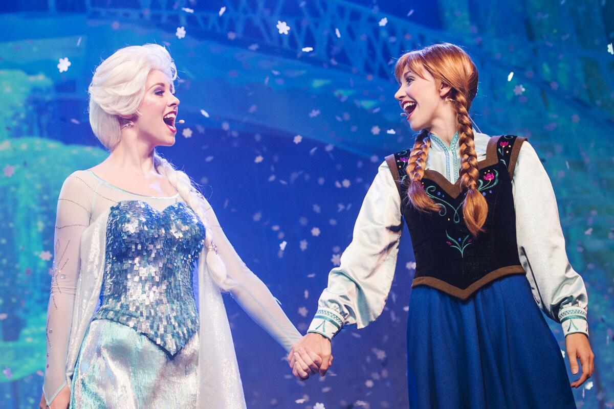 Cast members as princesses Elsa and Anna in the "Frozen Live" show at Disney California Adventure.