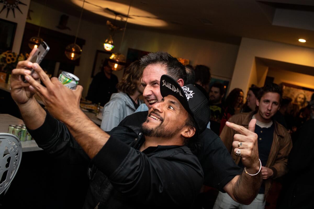 Fransisco Alexander Alvarado takes a selfie with David Arquette.