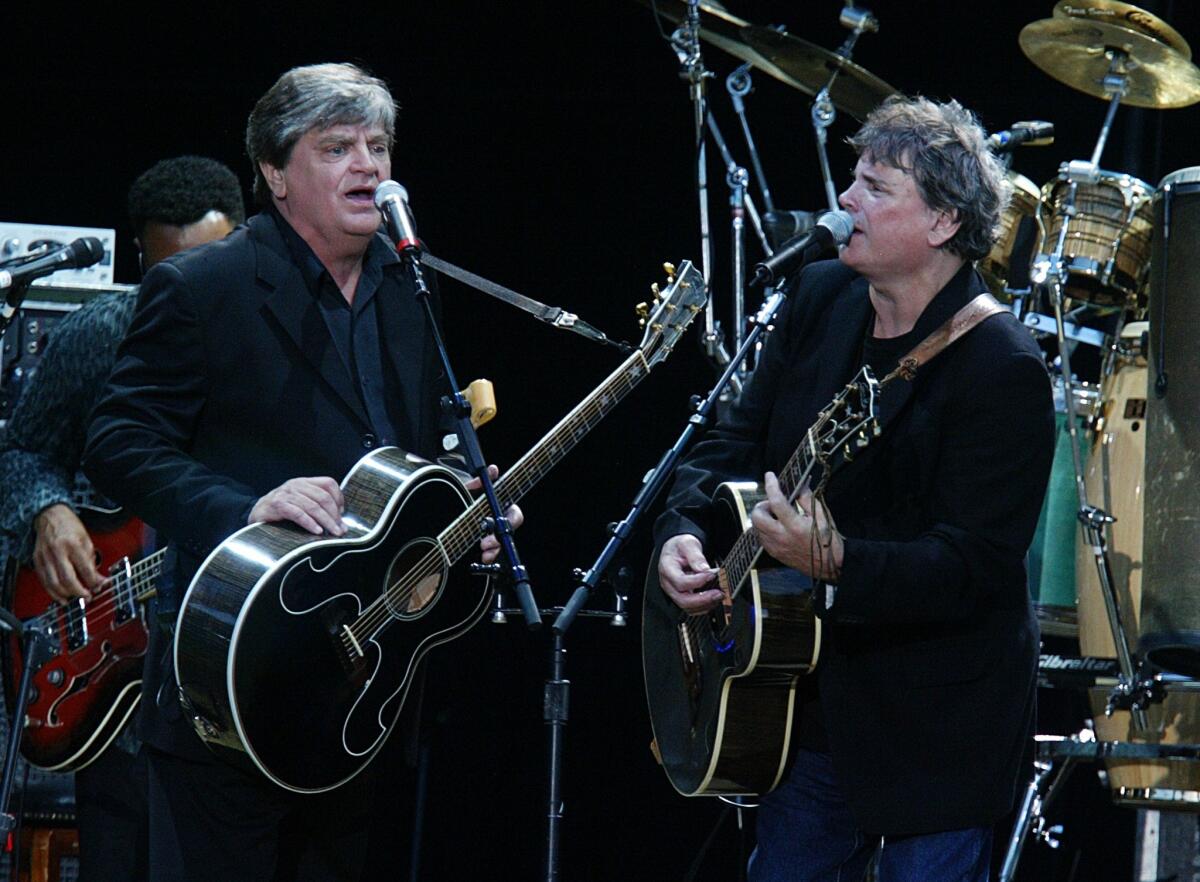 Phil Everly, left, and his brother Don Everly, right, will be saluted Oct. 25 by Vince Gill, Emmylou Harris and numerous others at the Rock and Roll Hall of Fame's annual Music Masters concert tribute in Cleveland.