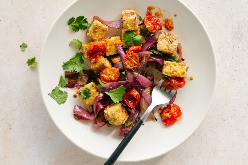 Crispy tofu tossed with tomatoes and red onions.