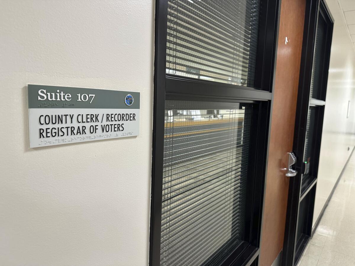 A sign marks an office at the Yuba County Registrar of Voters building in Marysville, Calif. 