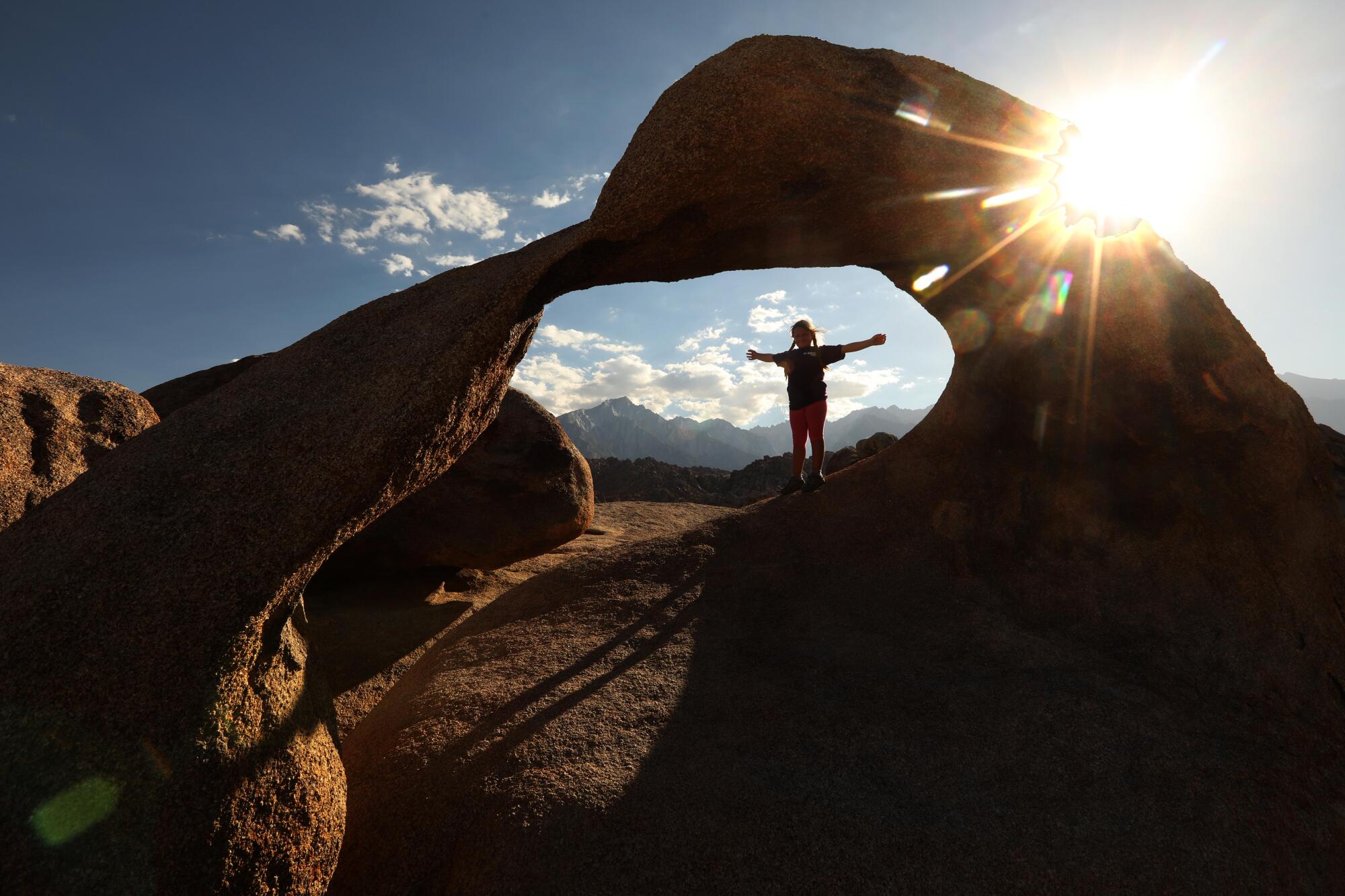 Charlie Heller, 7, of Simi Valley is framed by the Mobius Arch which is part of Alabama Hills National Scenic Area.