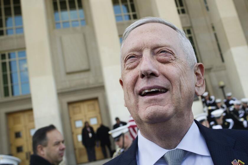 FILE - In this Wednesday, Nov. 28, 2018, file photo, then-Secretary of Defense Jim Mattis speaks with reporters before welcoming Lithuanian Minister of National Defense Raimundas Karoblis to the Pentagon in Washington. Former Secretary of Defense Jim Mattis has a book coming, but he warns it will not be a tell-all about President Donald Trump. (AP Photo/Cliff Owen, File)