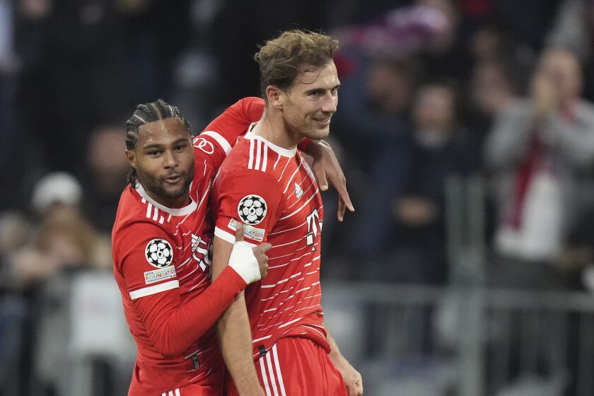 Bayern's Serge Gnabry, left, celebrates with his teammate Leon Goretzka after scoring against Pizen during the Champions League group C soccer match between Bayern Munich and Viktoria Plzen in Munich, Germany, Tuesday, Oct. 4, 2022. (AP Photo/Matthias Schrader)