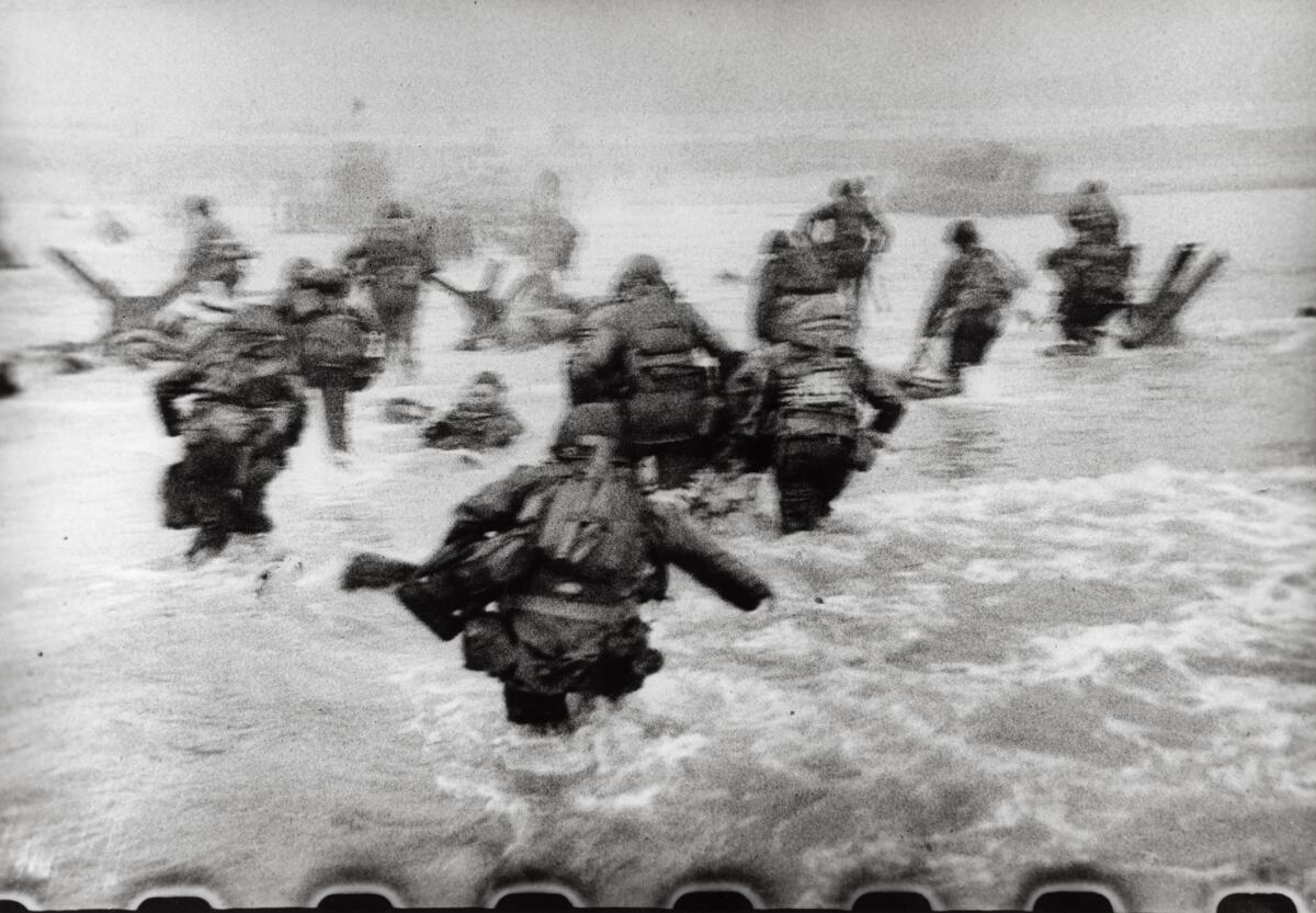 American forces arrive on Omaha Beach. (Robert Capa / Magnum Photos)