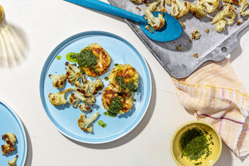 LOS ANGELES, CALIFORNIA, March 5, 2021: A Fish Cakes with Salsa Verde and Roast Cauliflower for the Week-of-Meals story by Ben Mims, photographed on Friday, March 5, 2021, at Proplink Studios in Arts District Los Angeles. (Photo / Silvia Razgova, Prop styling / Kate Parisian, Assist and Food styling / Leah Choi) ATTN: 725766-la-fo-cooking-weekofmeals