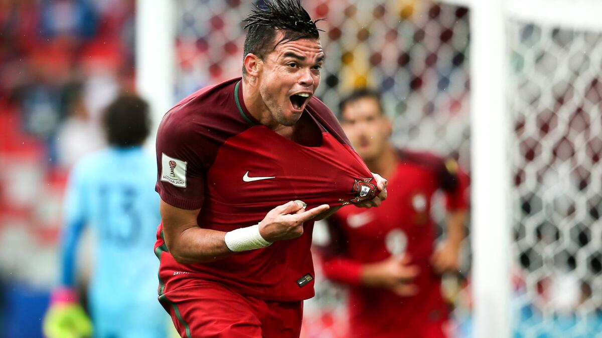 Pepe celebrates after scoring the equalizing goal for Portugal against Mexico on the third-place game of the Confederations Cup on Sunday.