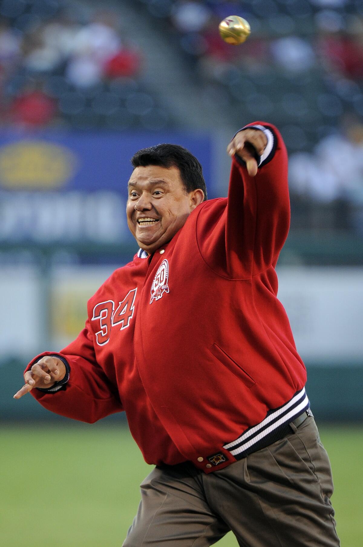 Former Dodgers and Angels pitcher Fernando Valenzuela throws out the ceremonial first pitch.
