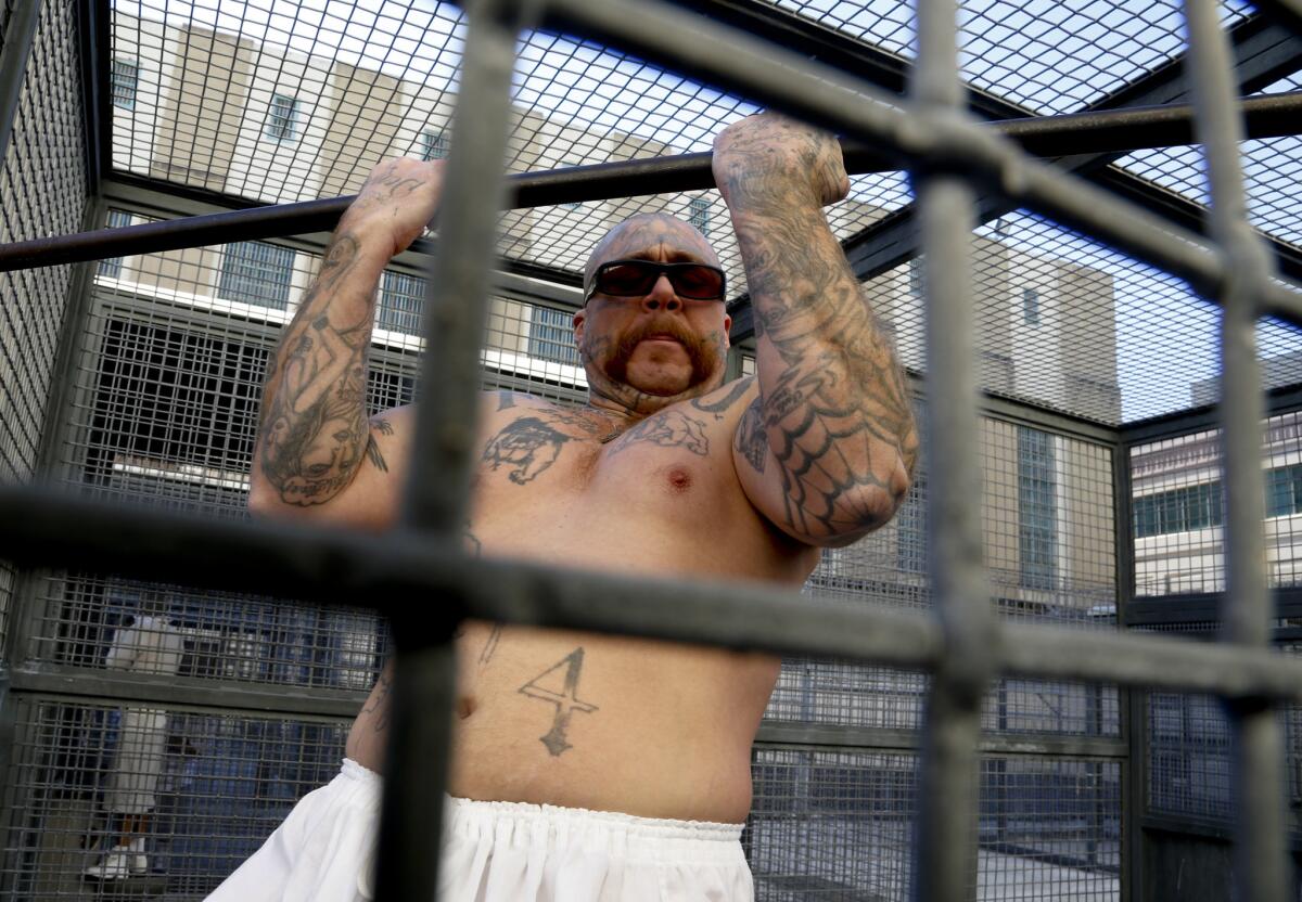 Condemned inmate Robert Galvan gets some exercise in the yard in the Adjustment Center at San Quentin prison.