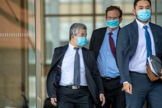 Los Angeles , CA - January 20: Raymond Chan, left, a former Los Angeles deputy mayor, and his attorney Harland Braun after a hearing for his upcoming trial on racketeering, fraud and bribery charges, exit Federal Court on Friday, Jan. 20, 2023 in Los Angeles , CA. (Irfan Khan / Los Angeles Times)