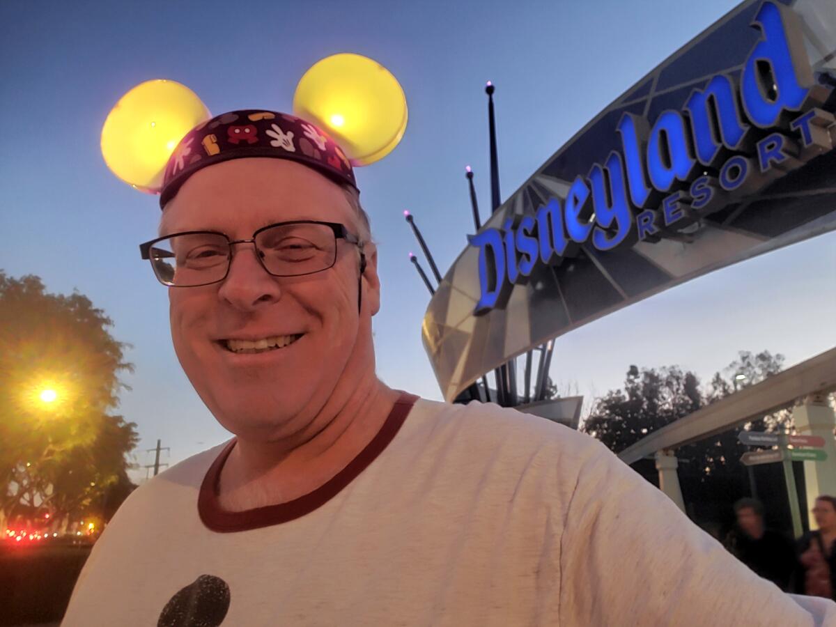 Disneyland lover Jeff Reitz, wearing a beanie with round ears that light up