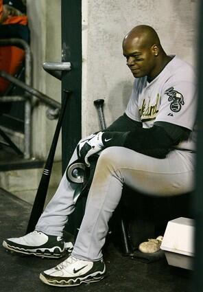 Oakland Athletics Frank Thomas sits in the dugout after grounding out into a double play during the eighth inning in Game 4 of the American League Championship Series in Detroit.