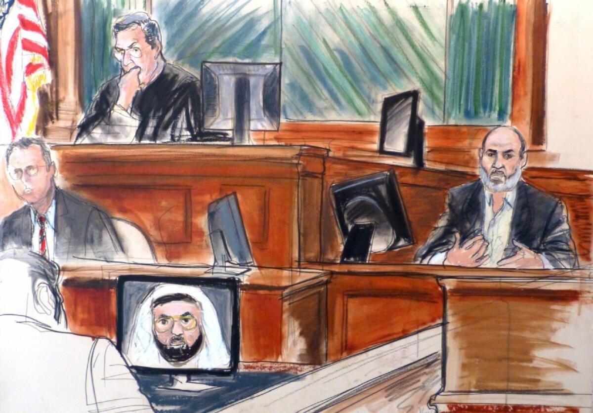 In this courtroom sketch, Sulaiman abu Ghaith, right, is shown testifying in his terrorism trial in New York. Jurors begin a second day of deliberations Wednesday.