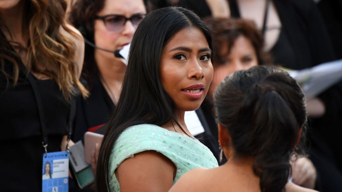 Yalitza Aparicio wore shades of apricot and peach on her face for a fresh and soft look.