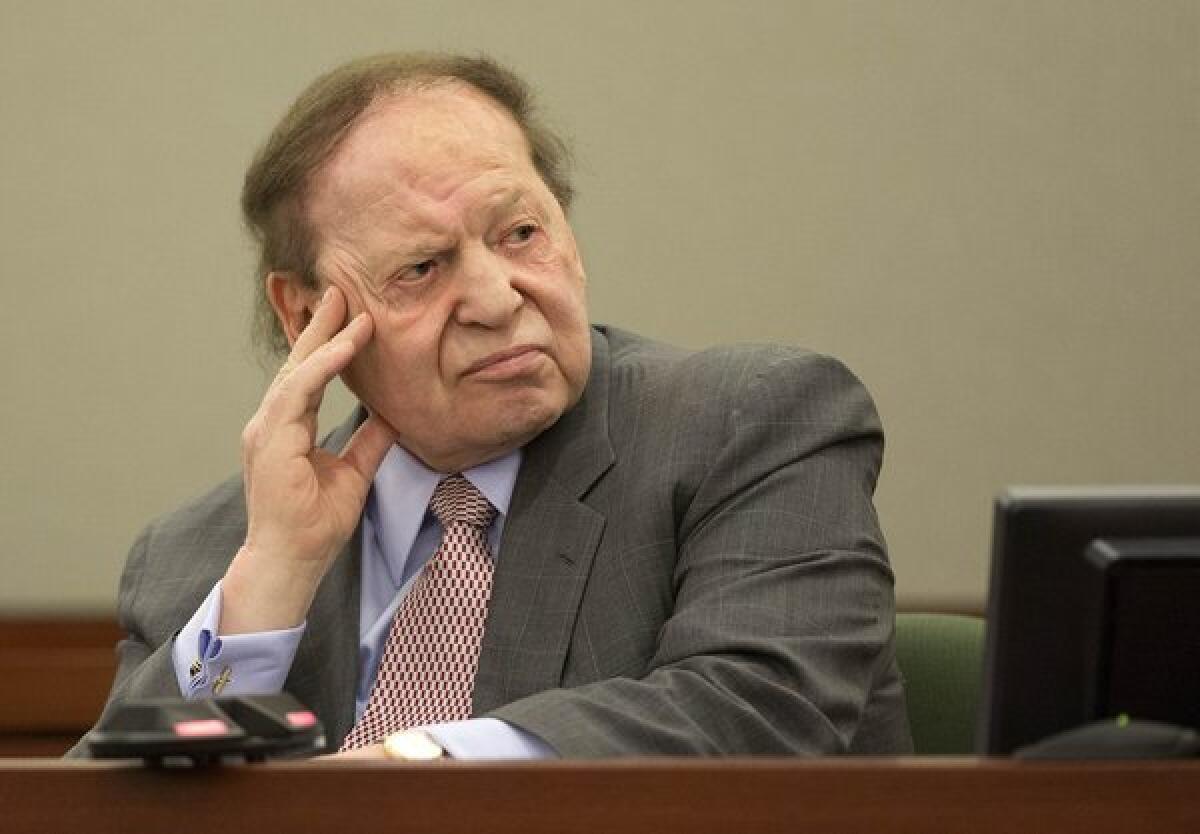 Las Vegas Sands Corp. CEO Sheldon Adelson testifies in a Las Vegas courtroom in April in a lawsuit filed by a former consultant. On Tuesday a jury awarded the consultant $70 million.