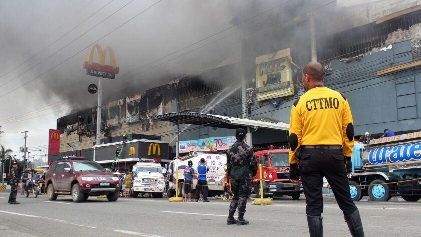 A shopping mall burns in Davao in the southern Philippines.