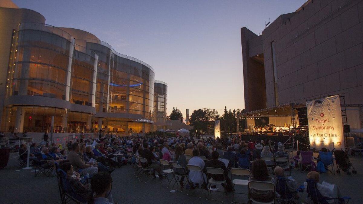 The Pacific Symphony, seen here performing outside the Renee and Henry Segerstrom Concert Hall in 2013, will be performing several concerts at the Pacific Amphitheatre in Costa Mesa this summer.