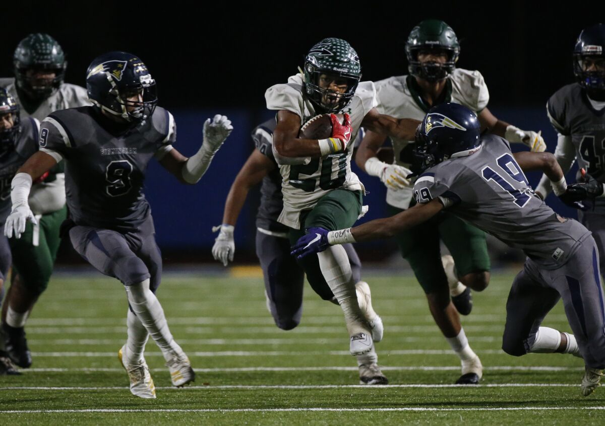 Pacifica running back Malik Sherrod carries the ball during the third quarter against Birmingham.