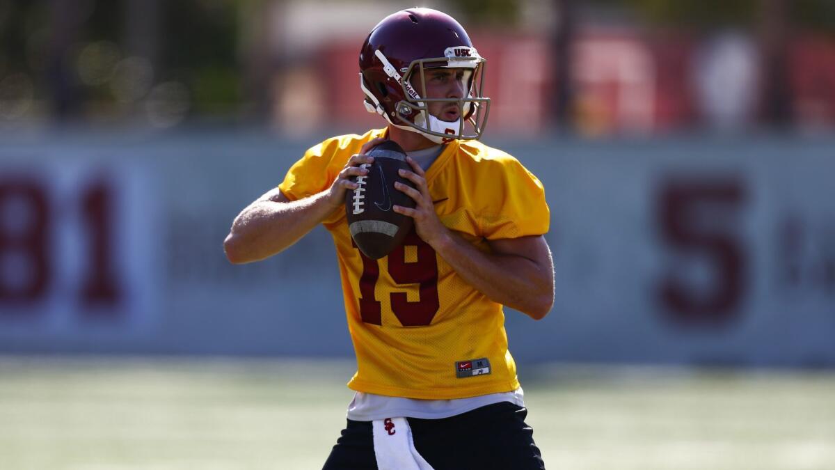 USC quarterback Matt Fink passes during drills at fall camp on the campus of USC.