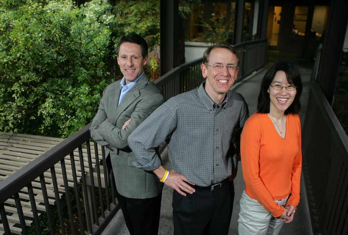 Venture capitalist John Doerr, middle, poses for a portrait with partners John Denniston, left, and Ellen Pao outside their office in Menlo Park on April 4, 2006.