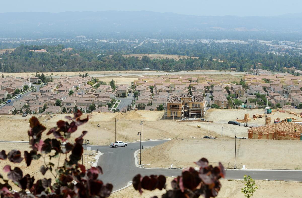 New homes under construction at Toll Brothers' Westcliffe development are seen in Porter Ranch. A shortage of new housing has helped push up prices in Southern California.