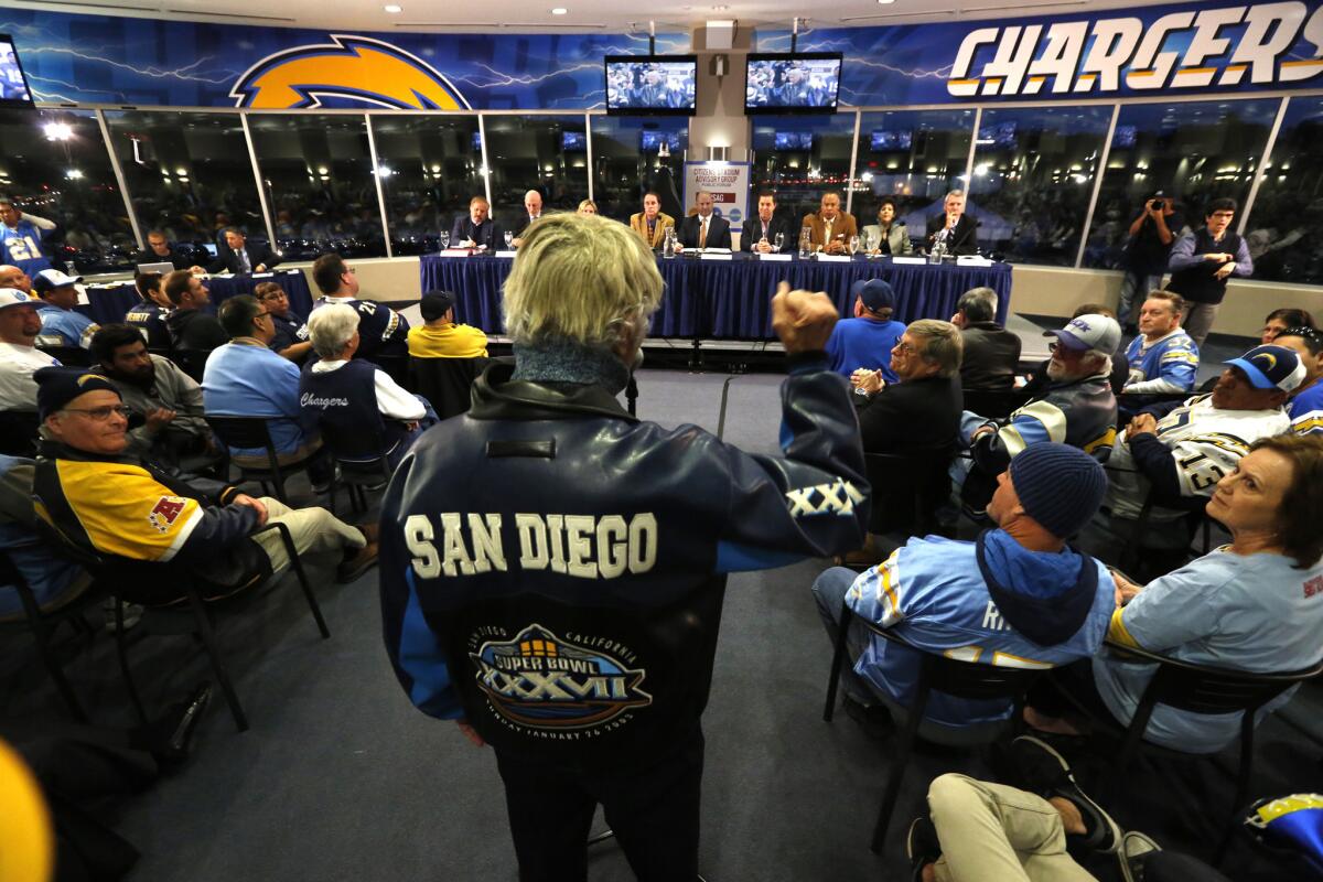 Dion Rich, age 85, who says he has attended every Charger home game since 1961, addresses a mayoral committee meeting at Qualcomm Stadium on March 2.