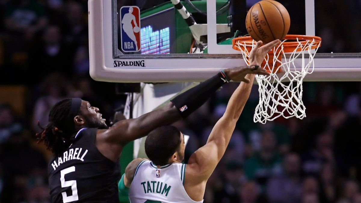 Clippers forward Montrezl Harrell (5) reaches to try to block a shot by Boston Celtics forward Jayson Tatum during the second quarter on Wednesday of their Feb. 14, 2018, game.
