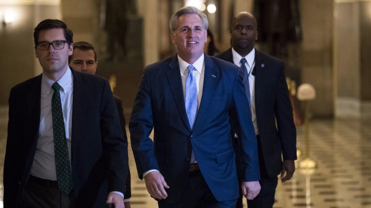 House Majority Leader Kevin McCarthy (R-Bakersfield), right, walks to the House floor for a vote at the U.S. Capitol on Monday.