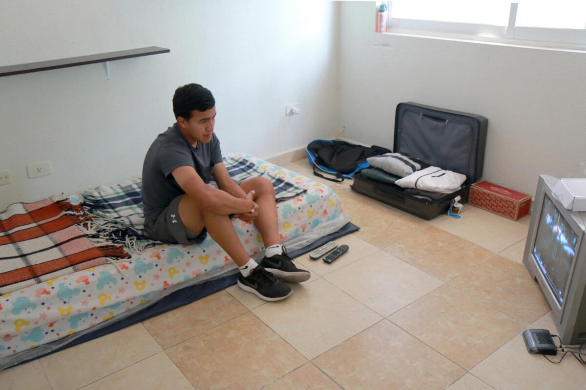 Dany Pulido relaxes in his room in Queretaro, Mexico.