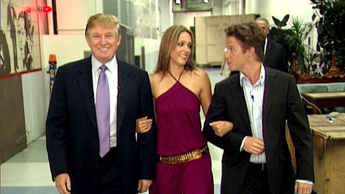 In a screen grab of a 2005 "Access Hollywood" video, Donald Trump prepares for his cameo on "Days of Our Lives" with actress Arianne Zucker and Billy Bush, right, then "Access" co-host. (Getty)