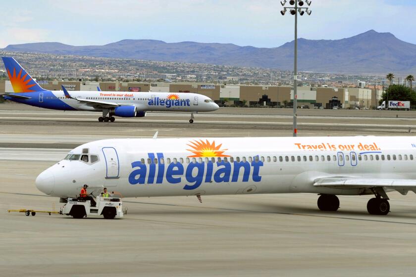 FILE- In this May 9, 2013, file photo, two Allegiant Air jets taxi at McCarran International Airport in Las Vegas. Allegiant Travel, the parent company of the Allegiant budget airline announced Thursday, Sept. 28, 2023 that CEO and director John Redmond resigned, effective immediately. The company isn't saying why he left. He's being replaced by the former CEO, Maury Gallagher, who held the job from 2003 until last year. Gallagher has been with Allegiant as majority owner since 2001, and was the CEO from 2003 until last year. (AP Photo/David Becker,File)