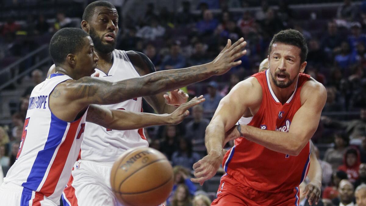 Clippers forward Hedo Turkoglu, right, passes around Detroit Pistons guard Kentavious Caldwell-Pope during the Clippers' 104-98 win on Nov. 26.
