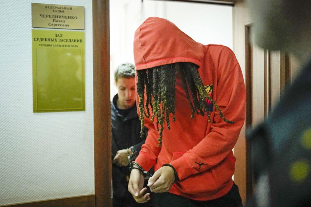 FILE - WNBA star and two-time Olympic gold medalist Brittney Griner leaves a courtroom after a hearing, in Khimki just outside Moscow, May 13, 2022. Griner, a two-time Olympic gold medalist, was detained at the Moscow airport in February after vape cartridges containing oil derived from cannabis were allegedly found in her luggage, which could carry a maximum penalty of 10 years in prison. (AP Photo/Alexander Zemlianichenko, File)