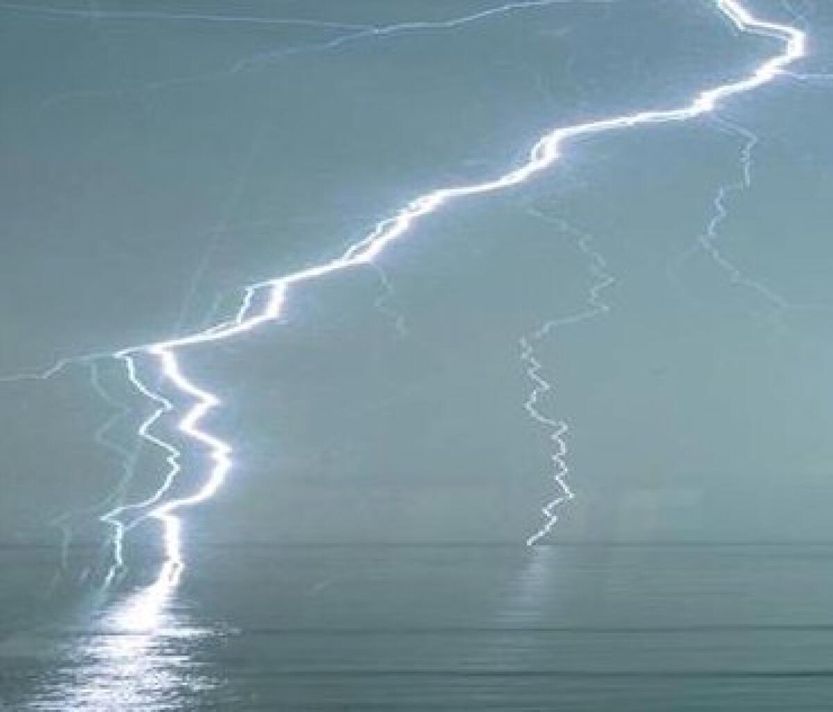 Lewis Surrey of Leucadia took this image of lightning hitting the ocean off Leucadia shortly after 7 a.m. on Wednesday. Surrey shot the photo through a window of his home on the bluffs above the beach. Lewis Surrey