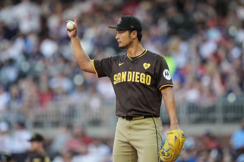 San Diego Padres pitcher Yu Darvish (11) works in the second inning of a baseball game against the Atlanta Braves, Sunday, May 19, 2024, in Atlanta. (AP Photo/Mike Stewart)