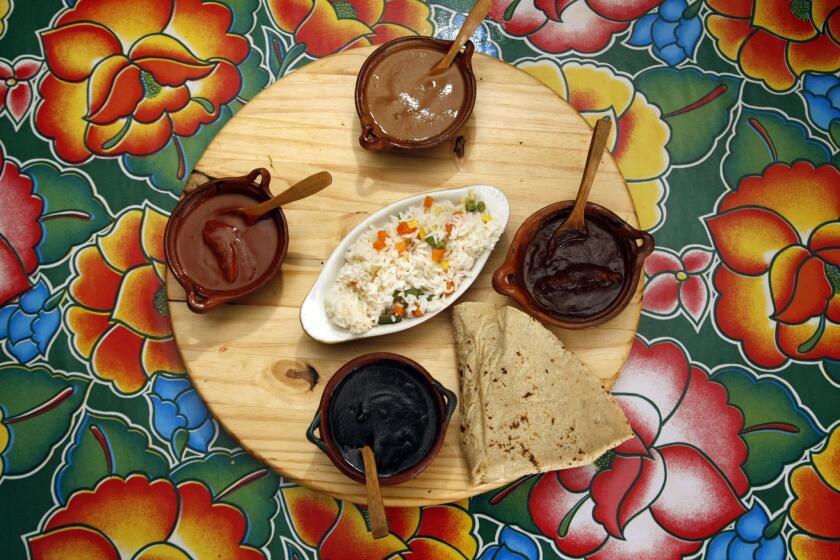 Shown is a molé sampler at Guelagetza restaurant, co-owned by Bricia Lopez, one of the founding members of the Taste of Mexico Food Festival.