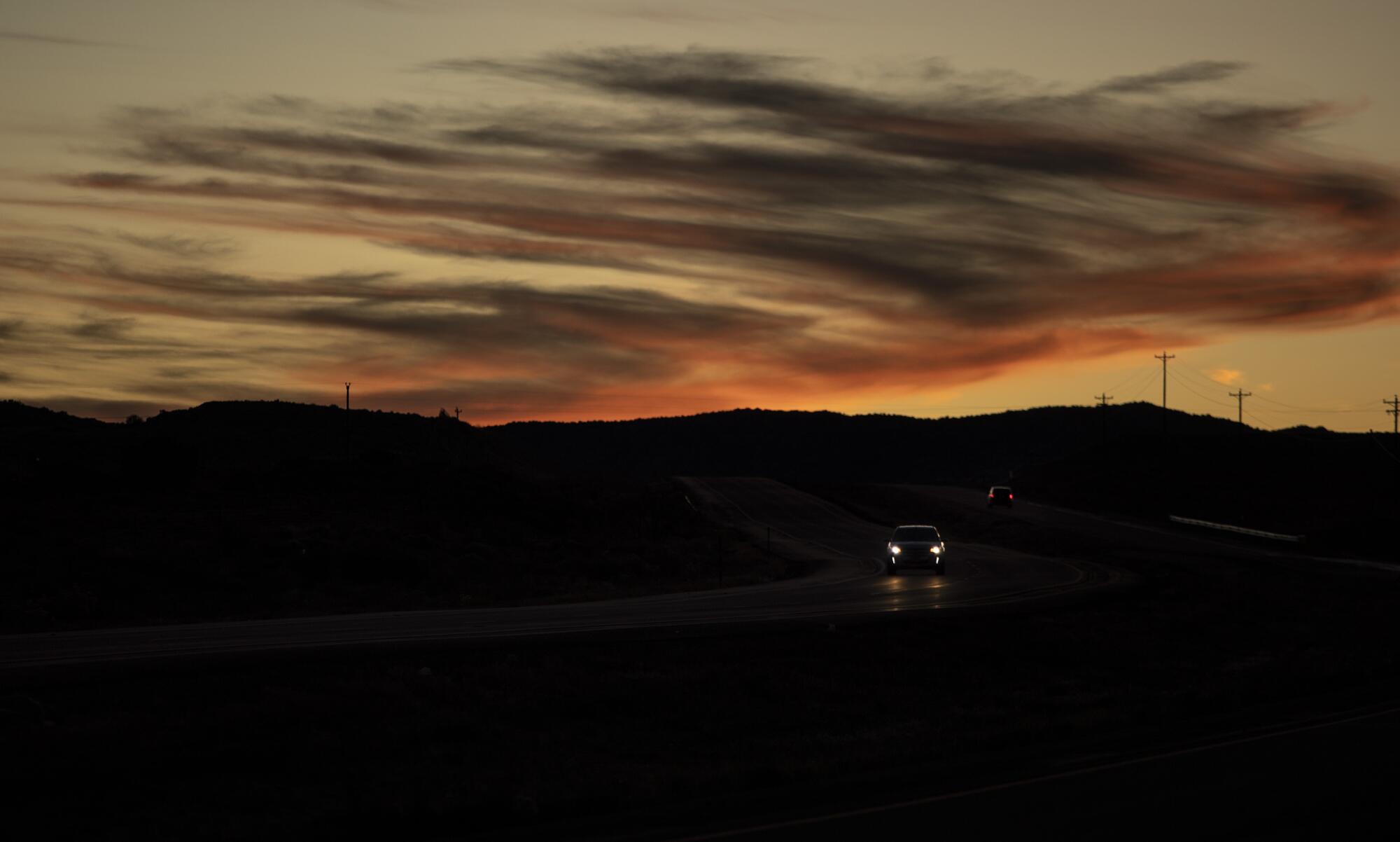 Night falls on a highway on Navajo Nation. 