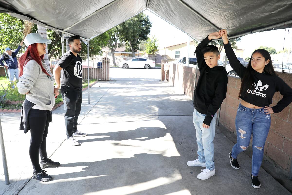 Cynthia Garcia, left, Salvador Ruiz, 11-year-old Marc Morales and Ashley Soltero.